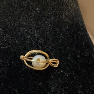 Gold plated hinged pendant with drilled pearl